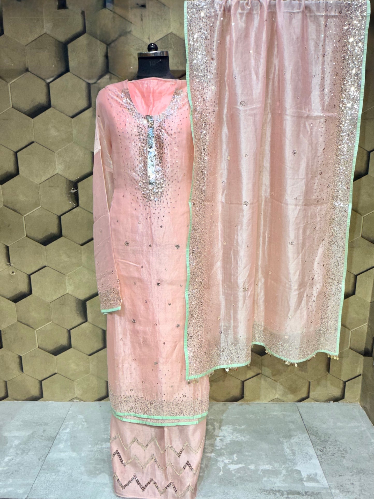 Elegant soft peach tissue with zari and intricate sequins embroidery