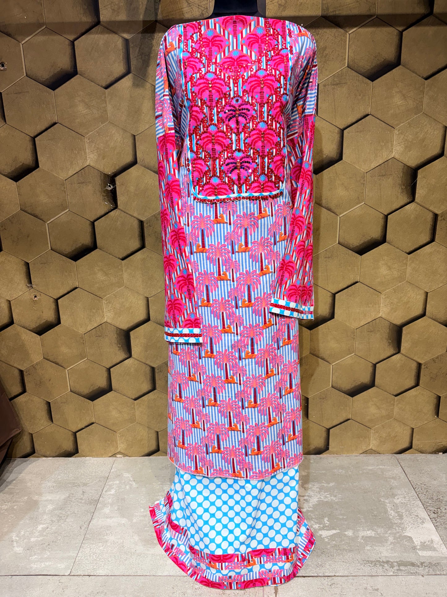 A stunning pure cotton co-ord set in a vibrant blend of blues, pinks, and reds