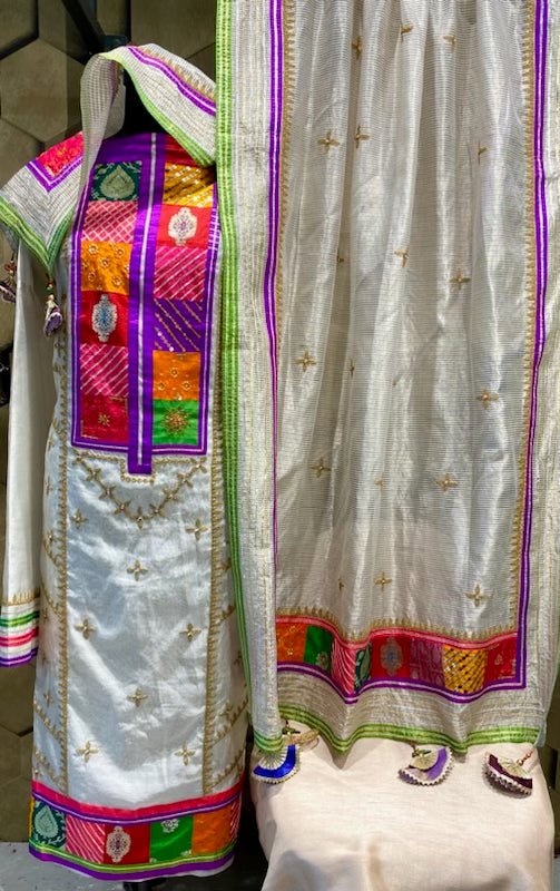 Classy and elegant off white with beautiful brocade and silk patches