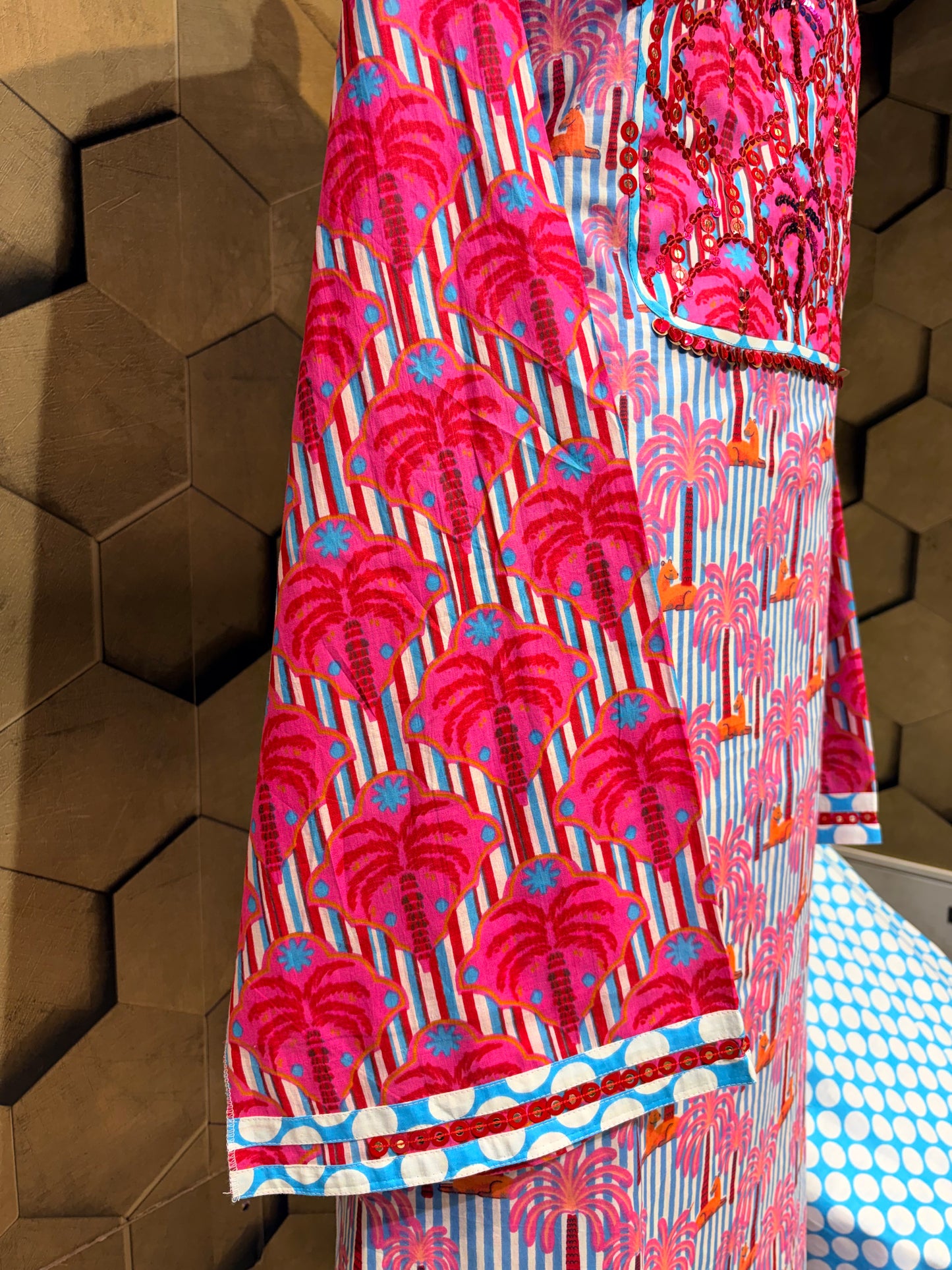 A stunning pure cotton co-ord set in a vibrant blend of blues, pinks, and reds