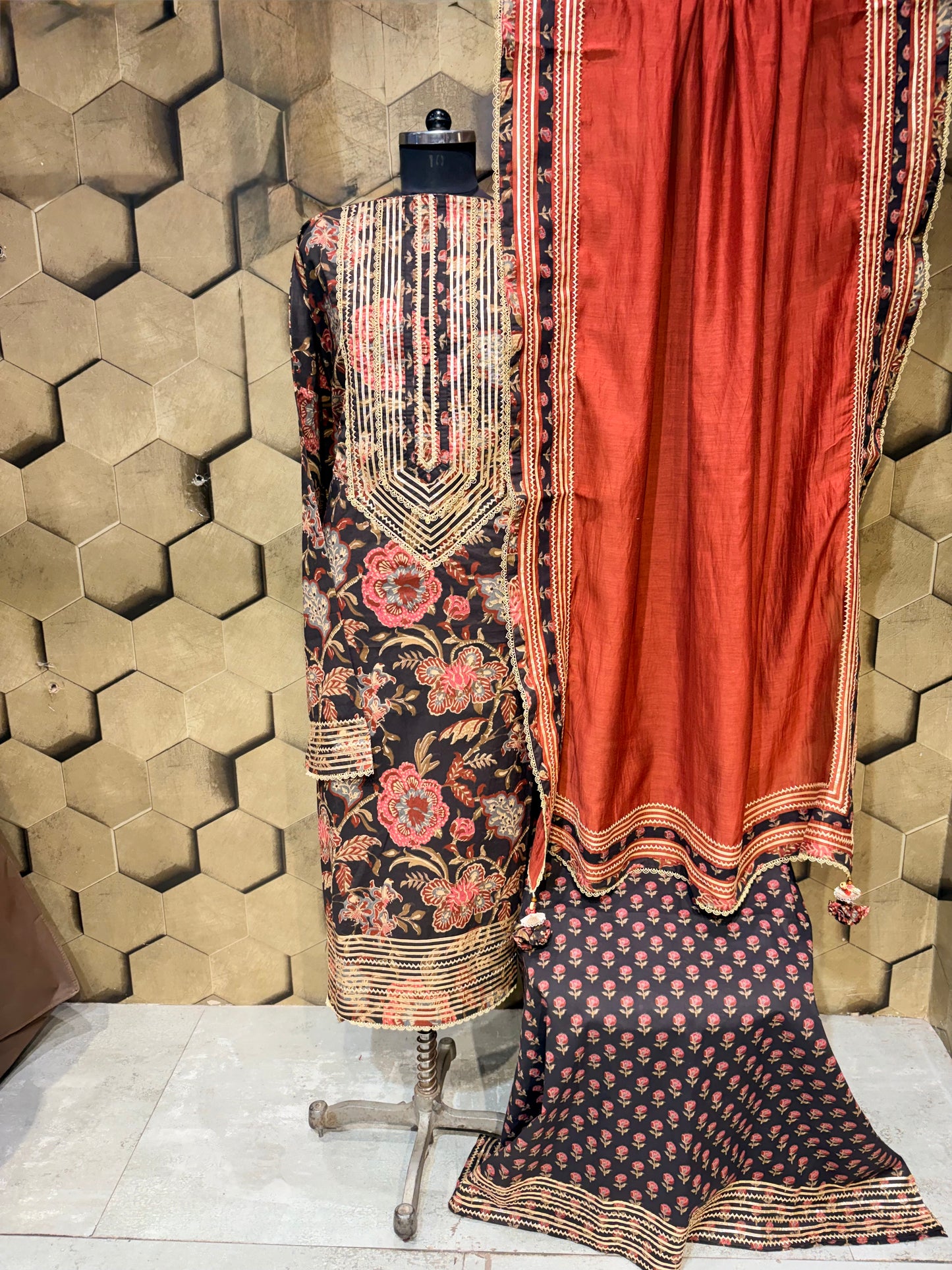 Pure cotton suit set in a timeless black shade with gotta detailings