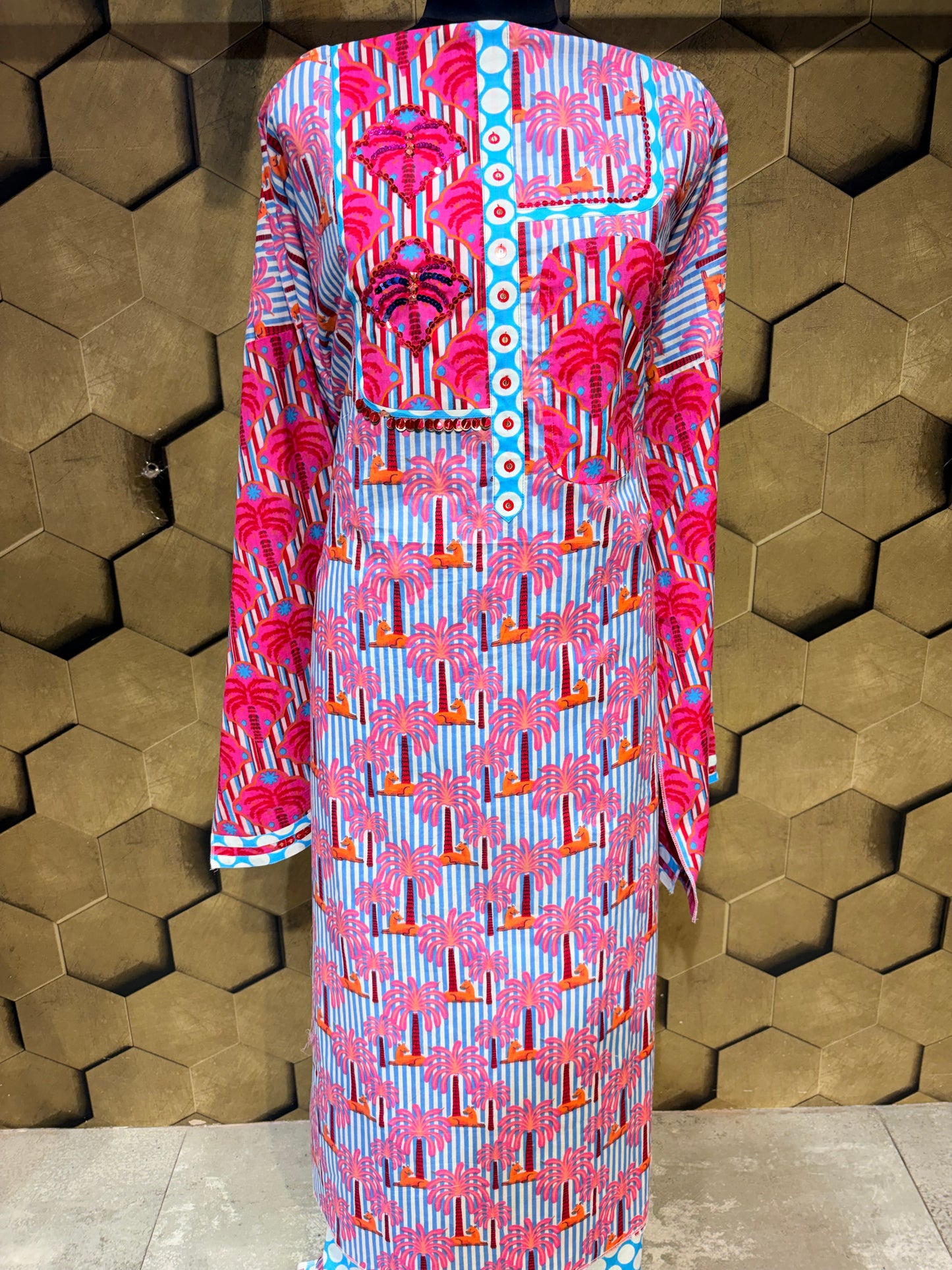 A stunning pure cotton co-ord set in a vibrant blend of blues, pinks, and reds