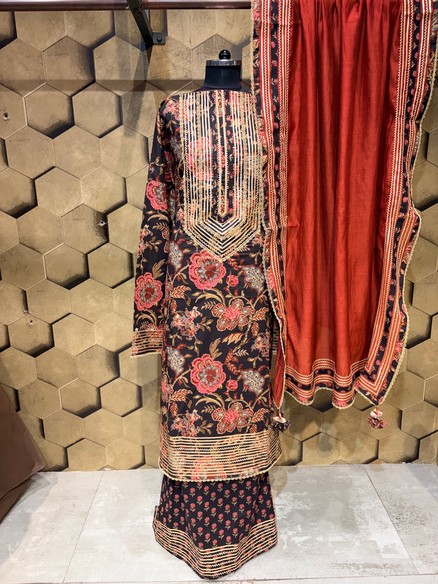 Pure cotton suit set in a timeless black shade with gotta detailings