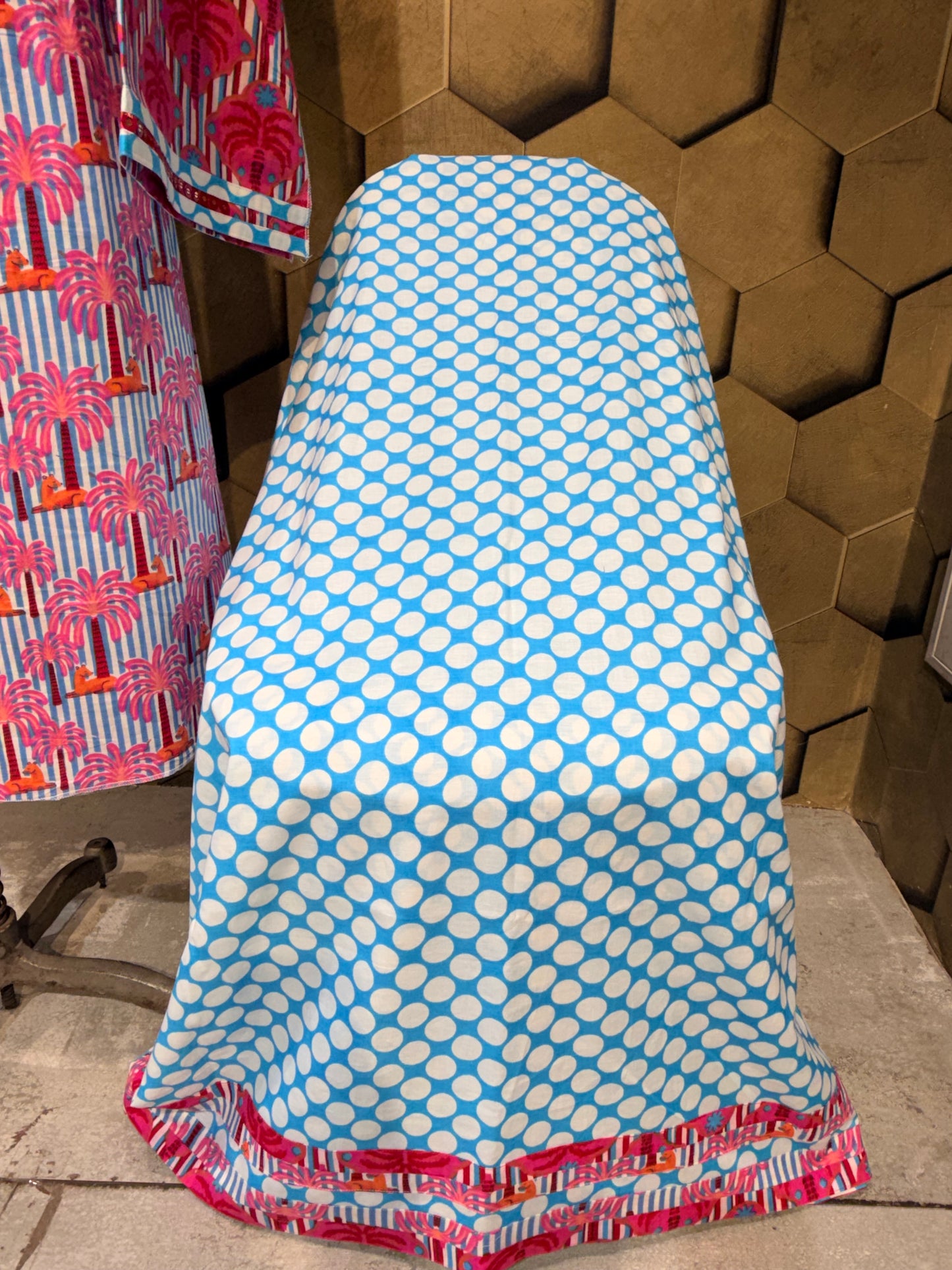 A stunning pure cotton co-ord set in a vibrant blend of blues, pinks, and reds