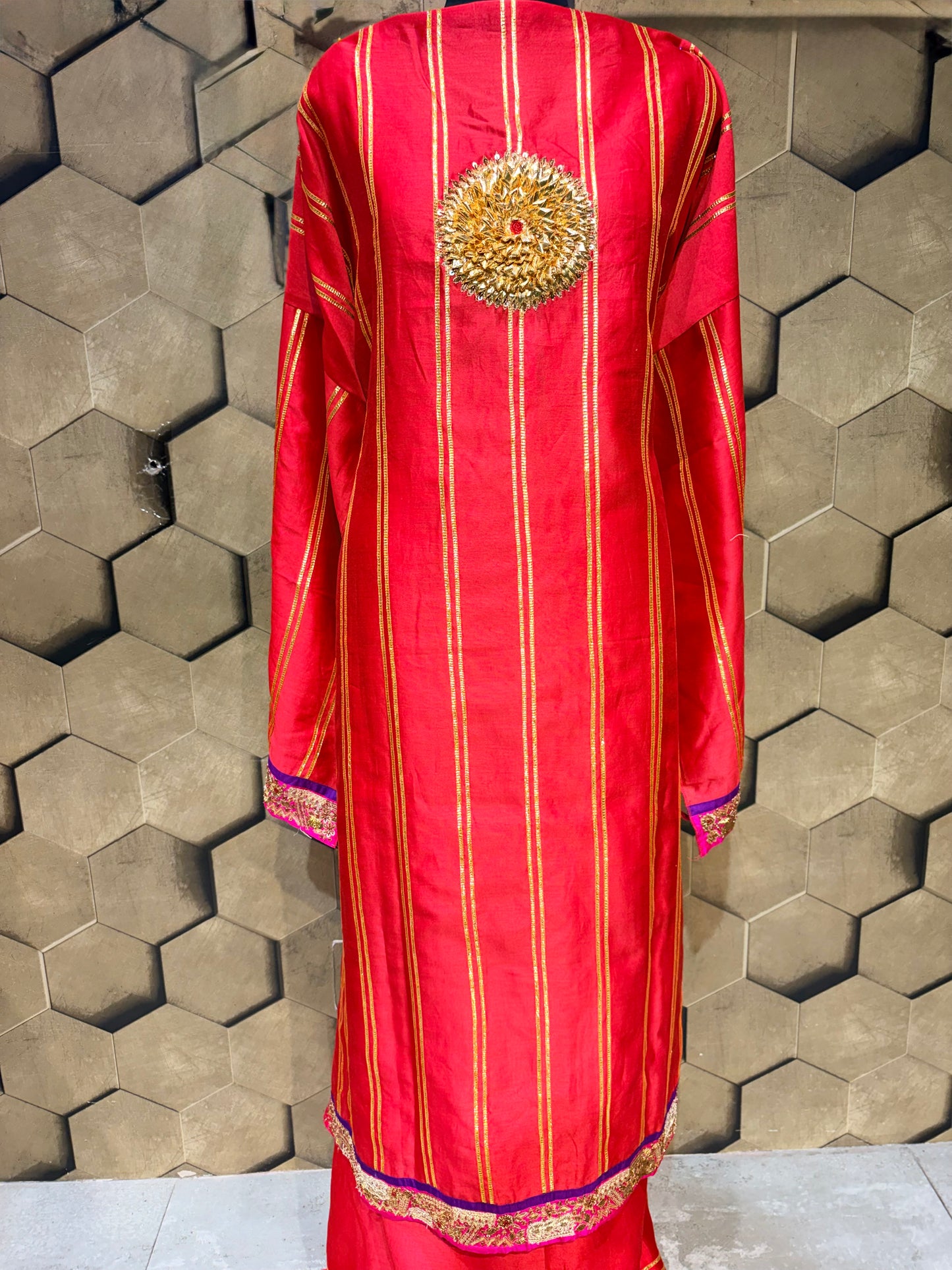An exquisite festive masterpiece in a stunning coral red Chanderi fabric