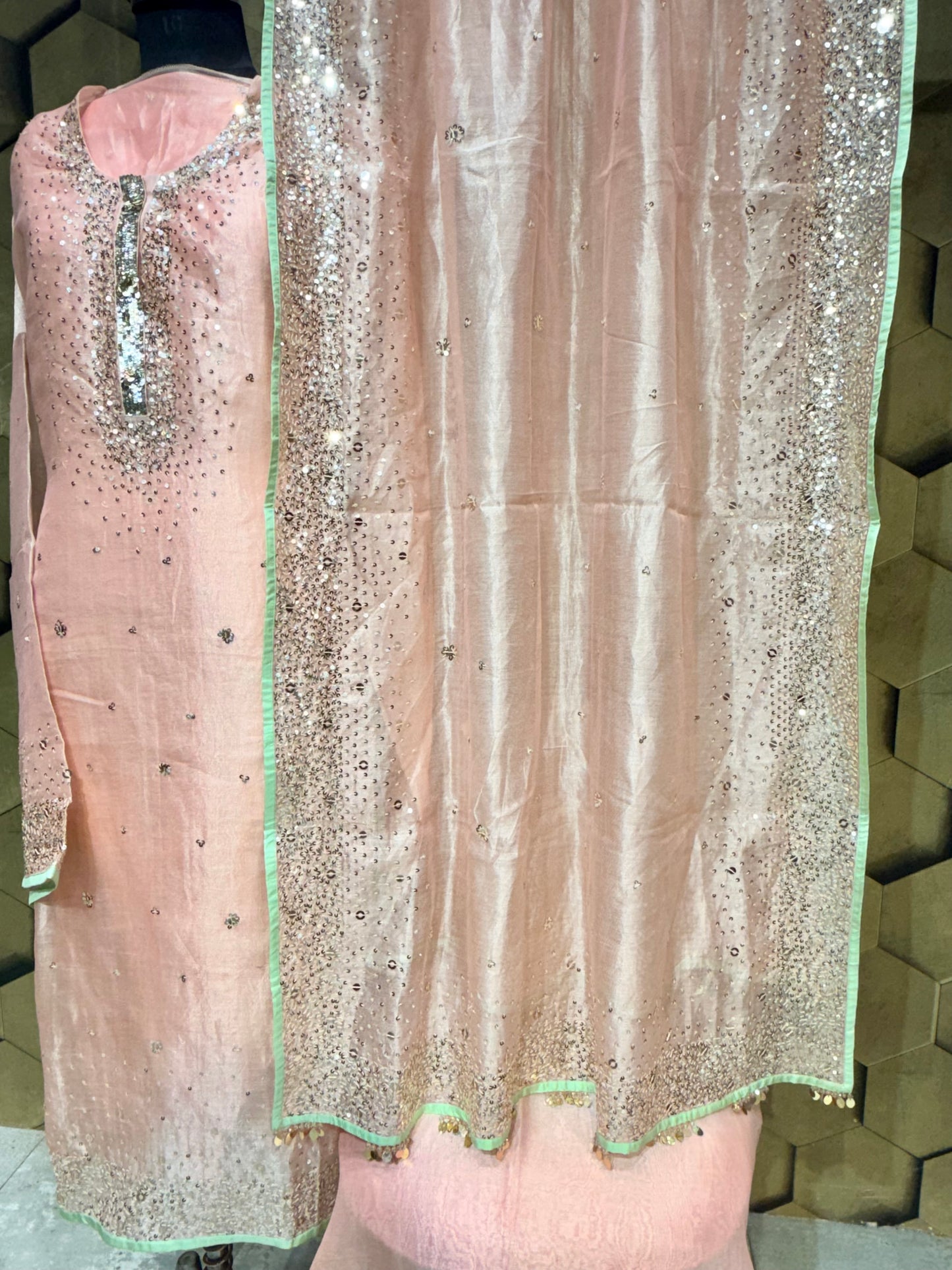 Elegant soft peach tissue with zari and intricate sequins embroidery