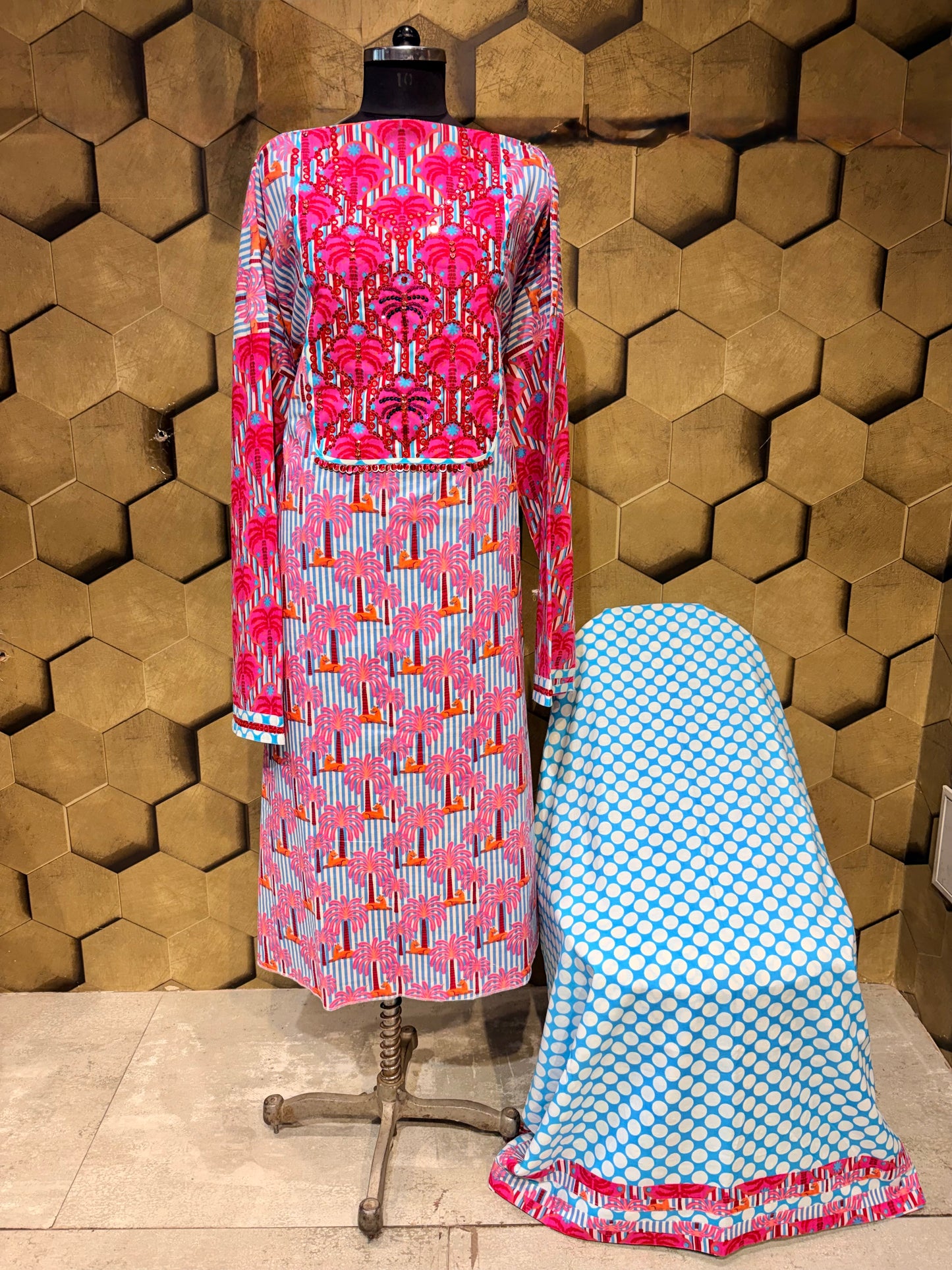 A stunning pure cotton co-ord set in a vibrant blend of blues, pinks, and reds
