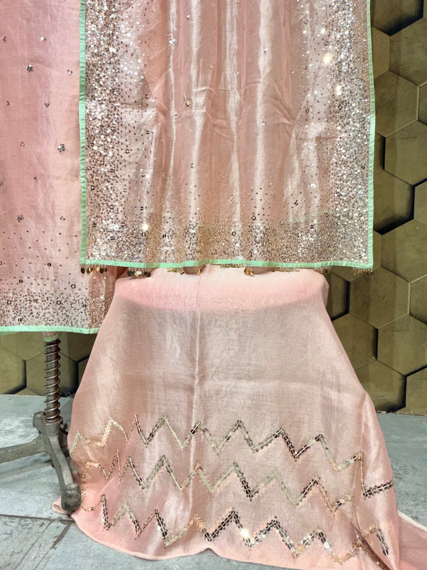Elegant soft peach tissue with zari and intricate sequins embroidery